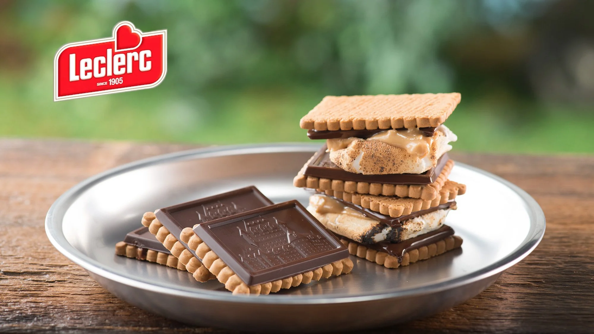 S'mores made with graham crackers, chocolate and toasted marshmallow on a plate.