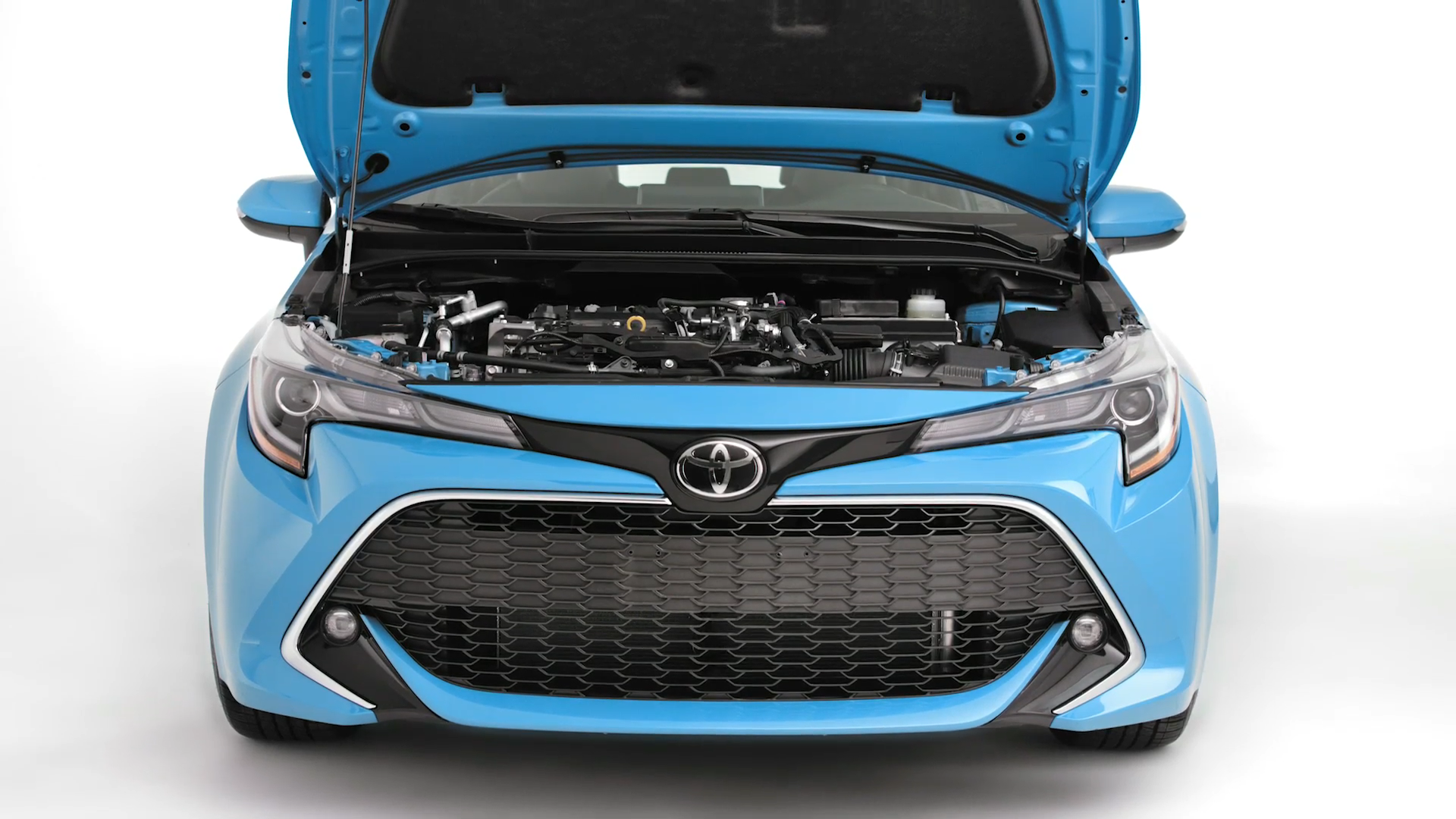 Front view of a blue Toyota car with its hood open, showing the engine compartment.