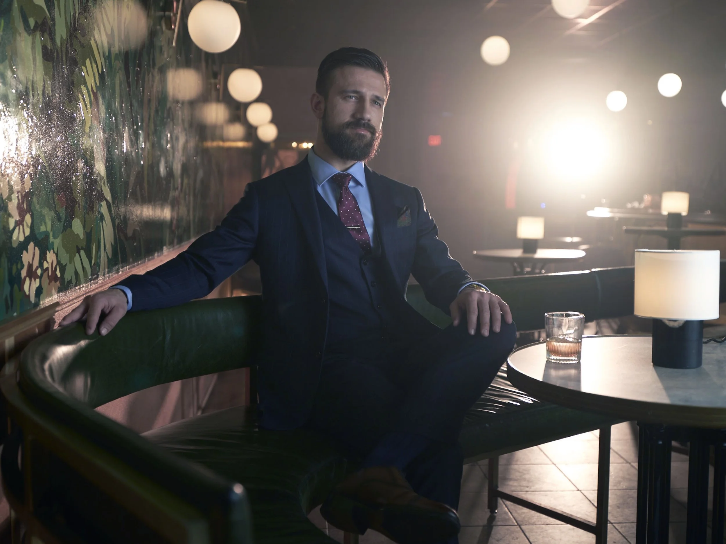 Commercial fashion and lifestyle photography featuring tailored menswear for the Indochino advertising campaign with cinematic lighting.
