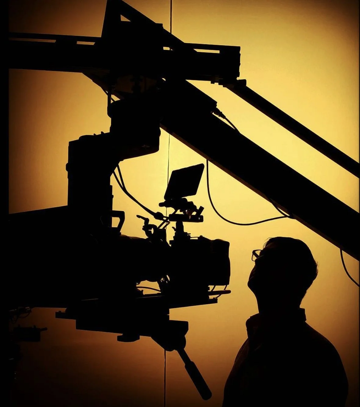 Behind-the-scenes commercial production featuring professional camera equipment and crew on an advertising photography and motion shoot.