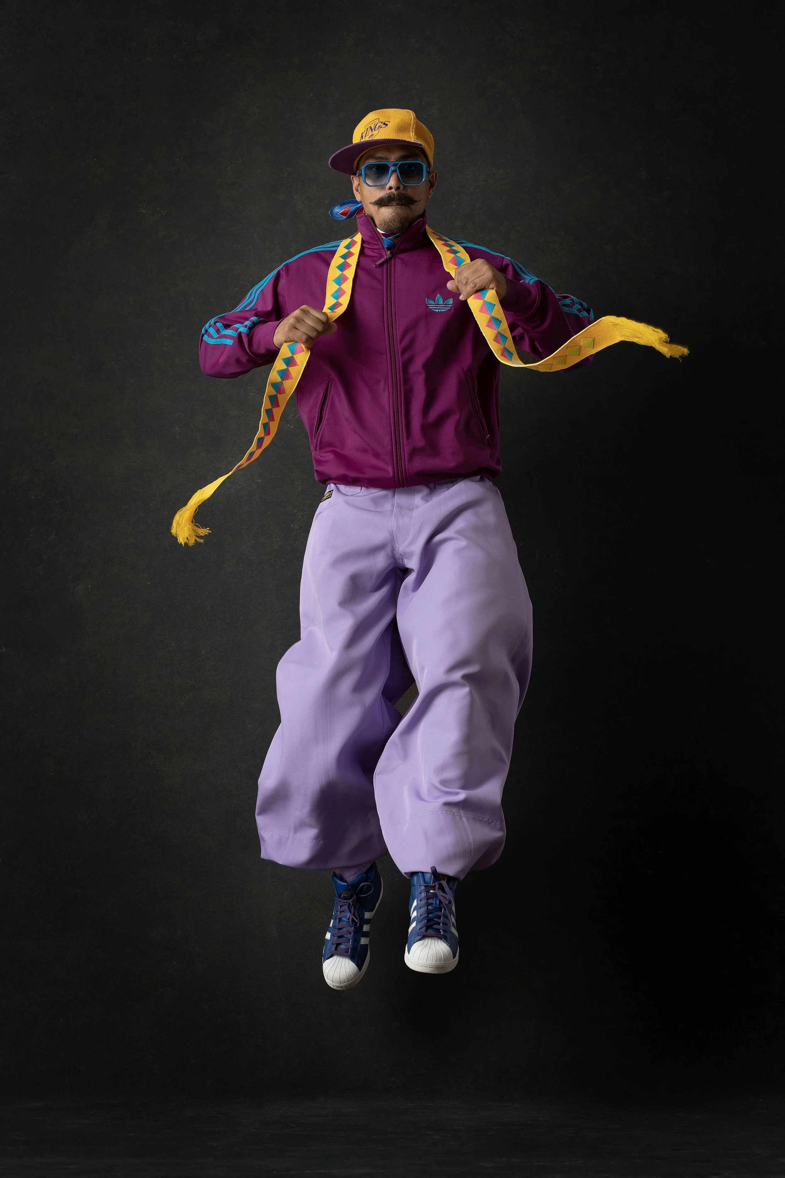 Commercial fashion advertising photography featuring a colourful Adidas-inspired streetwear look