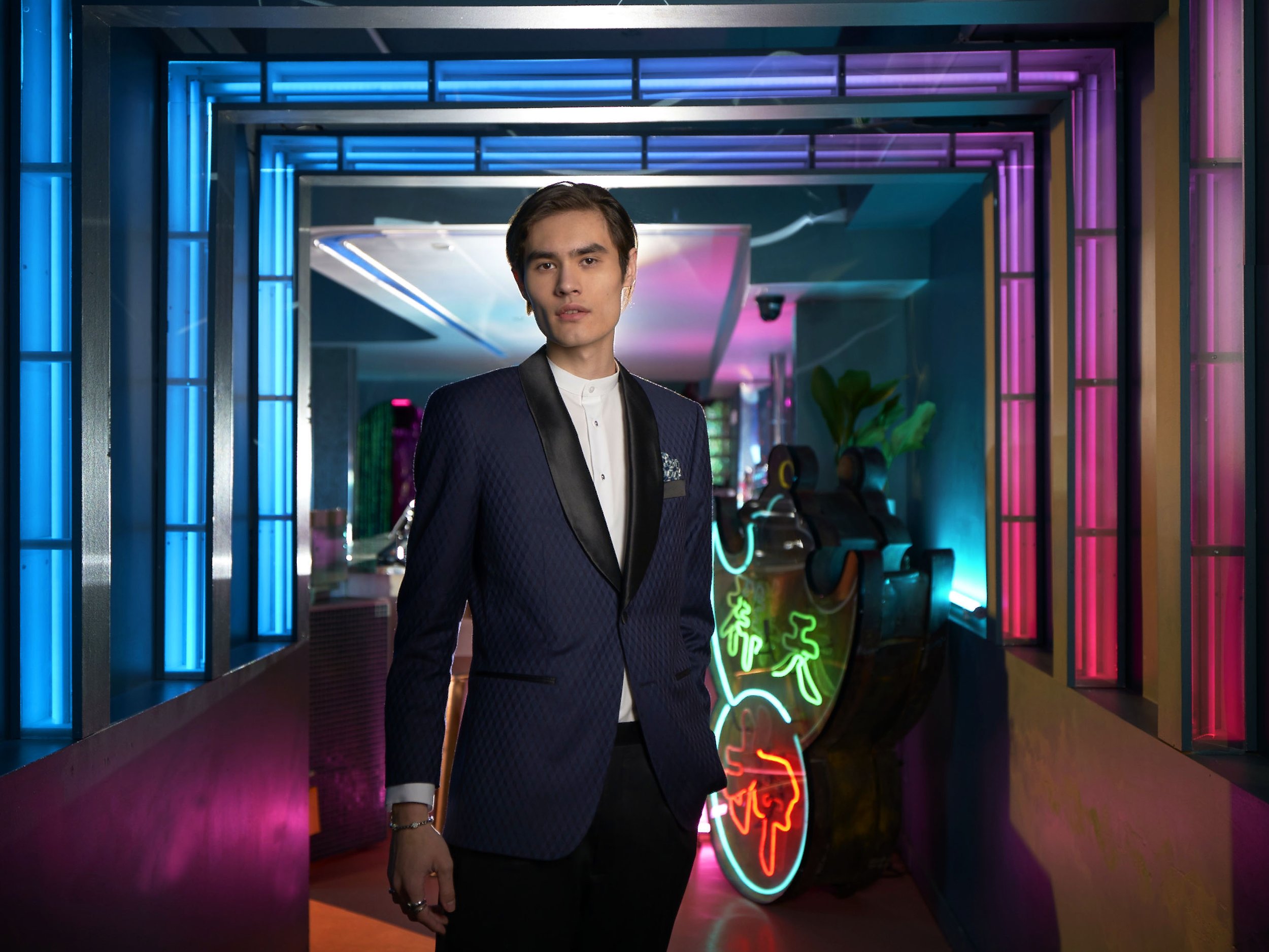 Commercial fashion photography featuring tailored menswear for the Indochino advertising campaign, photographed with creative architectural lighting.