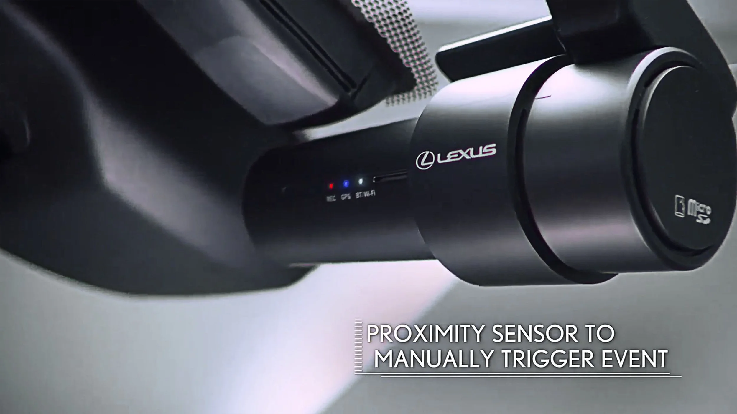 Close-up of a Lexus electronic device with a proximity sensor indicating event detection.