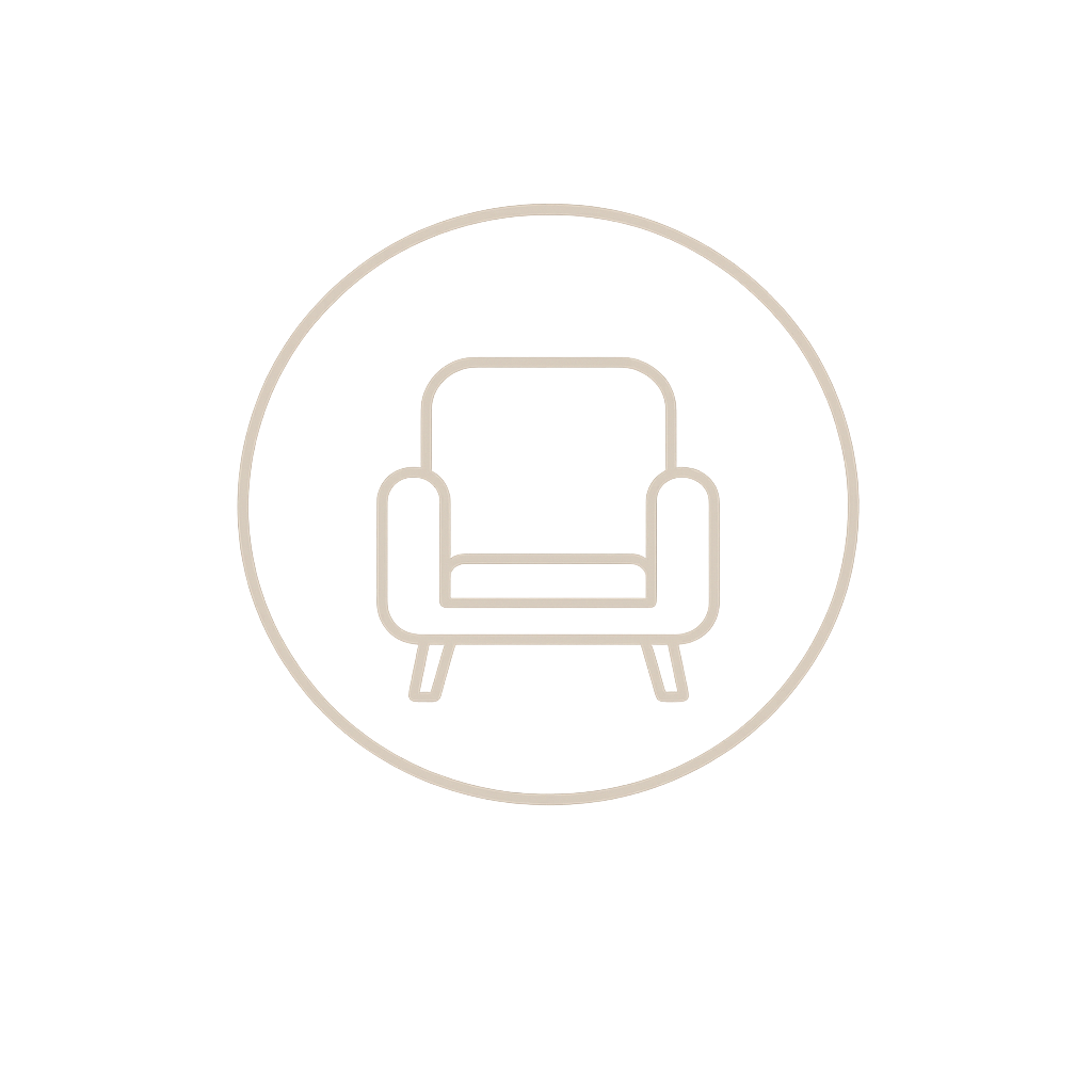An outline of a modern, cushioned armchair inside a circular border on a black background.