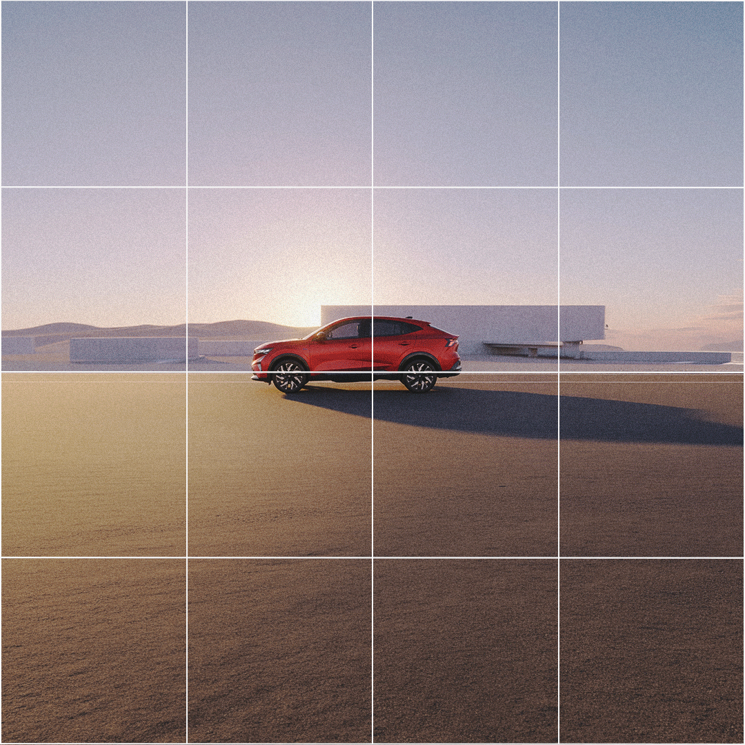 A red car parked on an empty road with a modern white building in the background, during sunset or sunrise.
