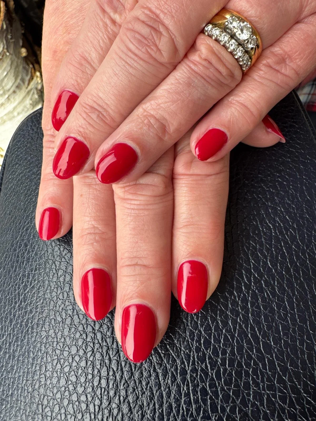 Bright red gel manicure on natural nails