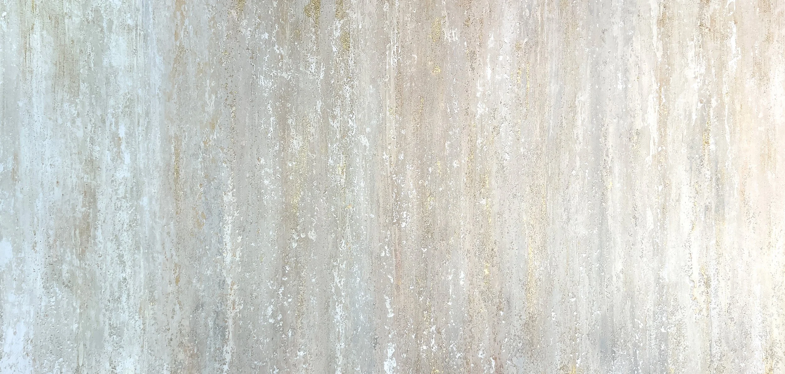 Close-up of a textured, weathered surface with a mix of light colors including beige, cream, and hints of gray, resembling a rough painted wall or concrete.