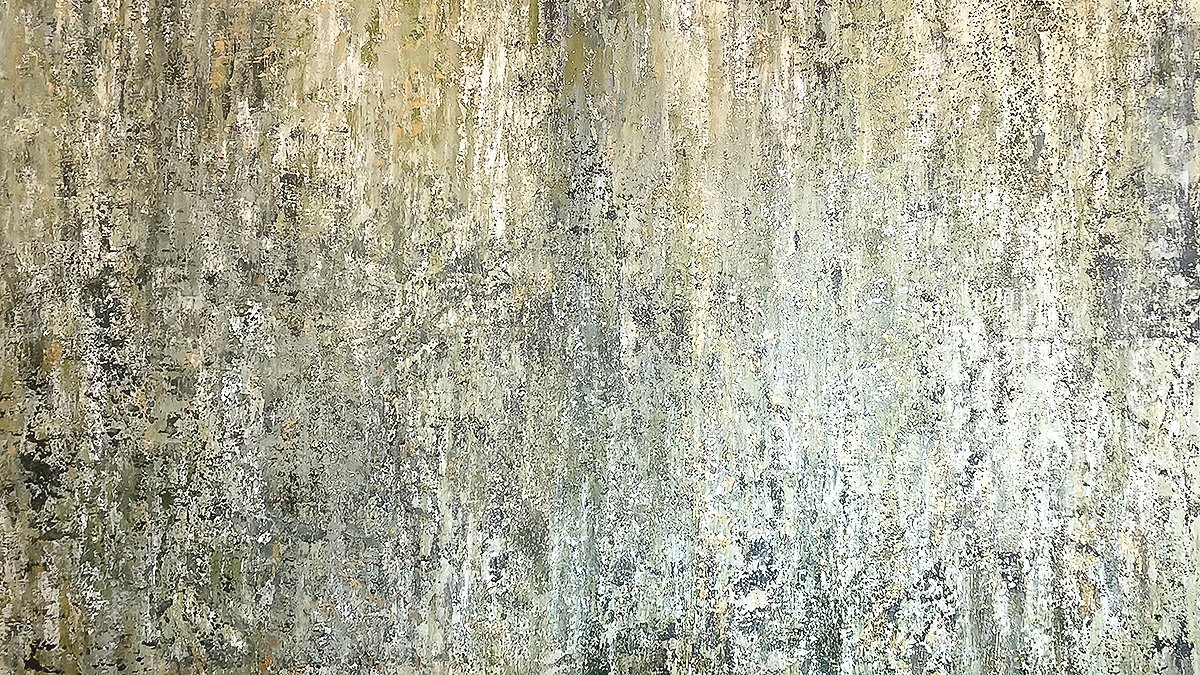 Close-up of a textured, weathered wall with peeling paint and moss growth.
