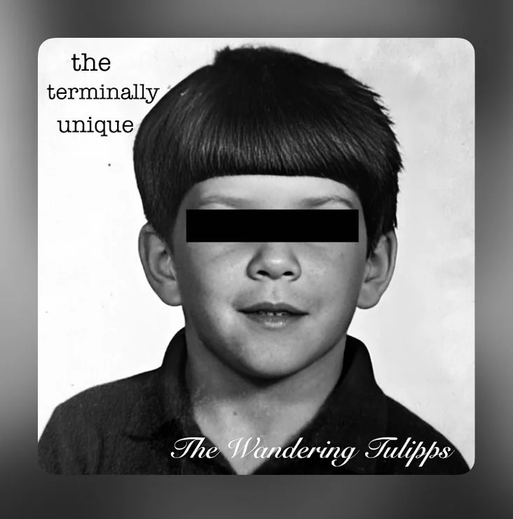 Album cover for The Terminally Unique by The Wandering Tulipps, featuring a vintage black-and-white childhood portrait with a black bar across the eyes.