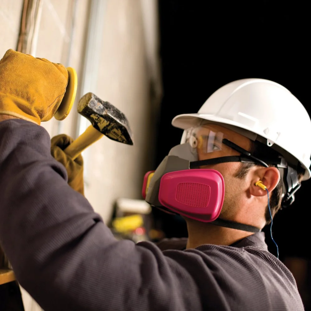 Worker wearing respirator during work. Annual qualitative fit testing for this respirator.