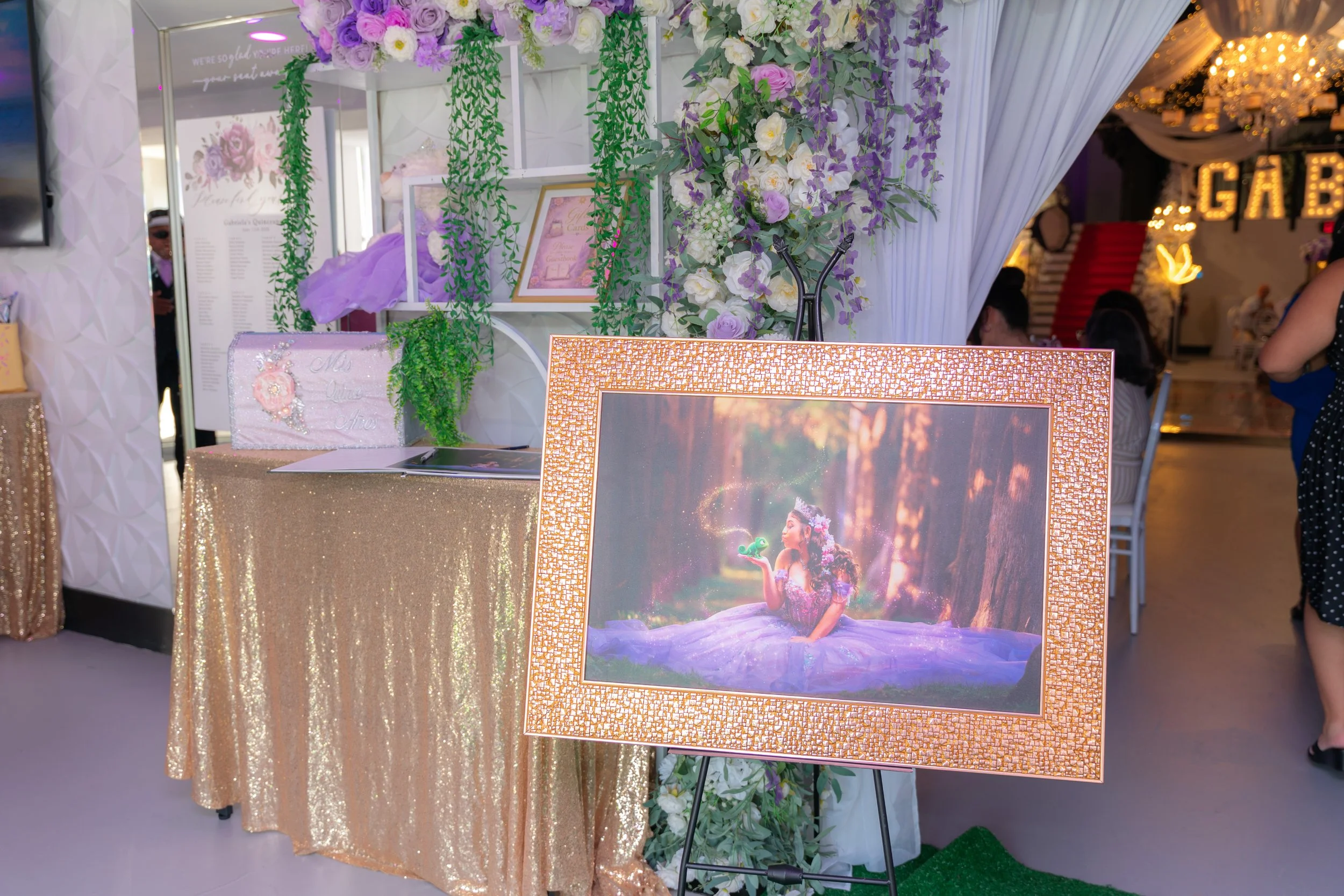 A photo frame of birthday girl in gown dress kissing frog.