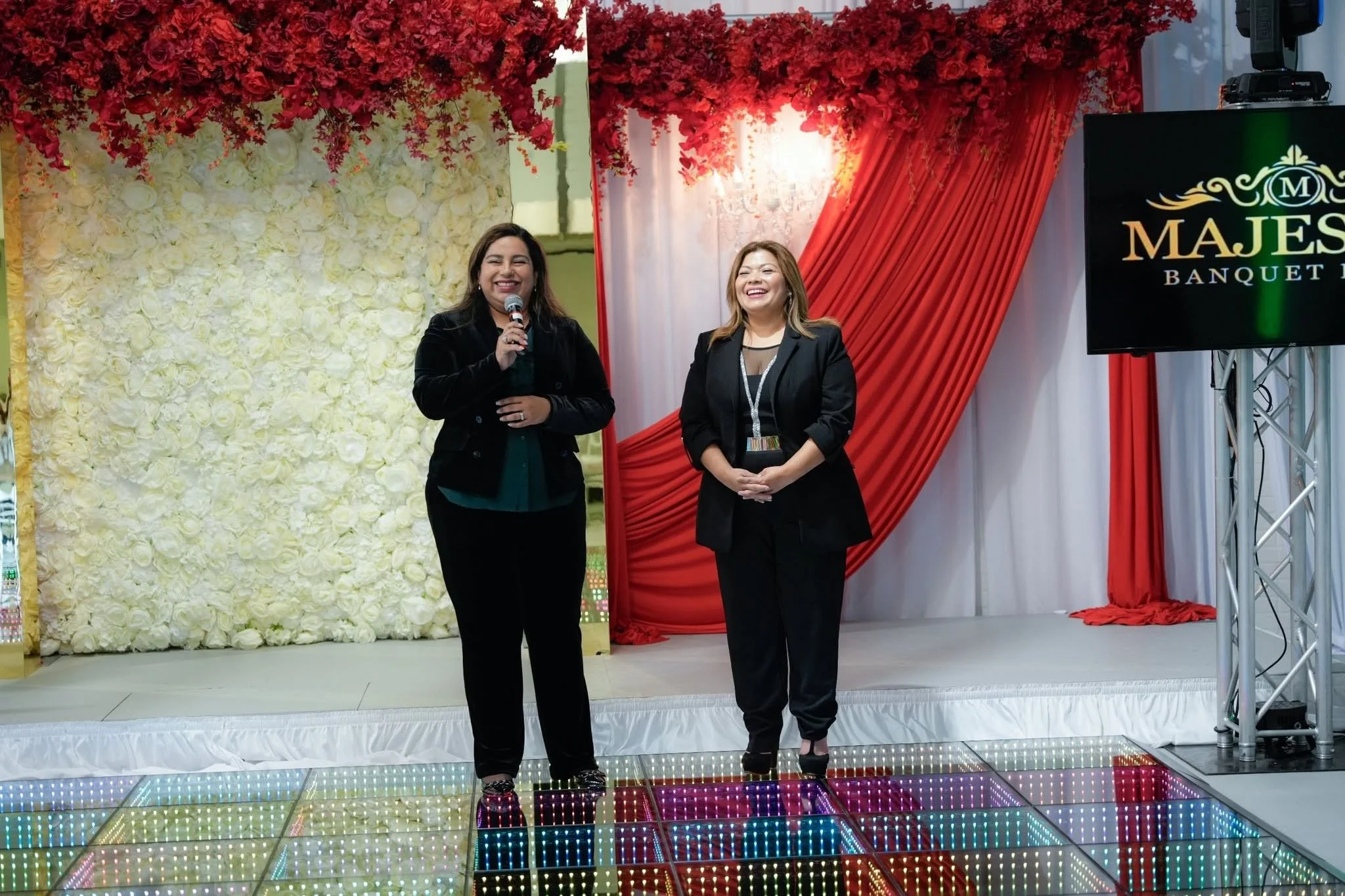 Two women speaking and smiling 