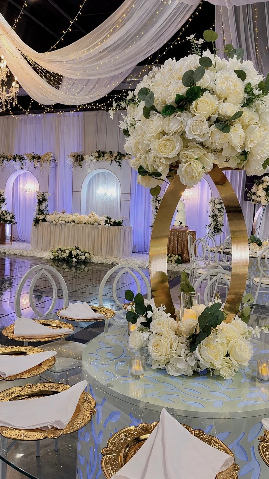 A table set with green and white flowers.