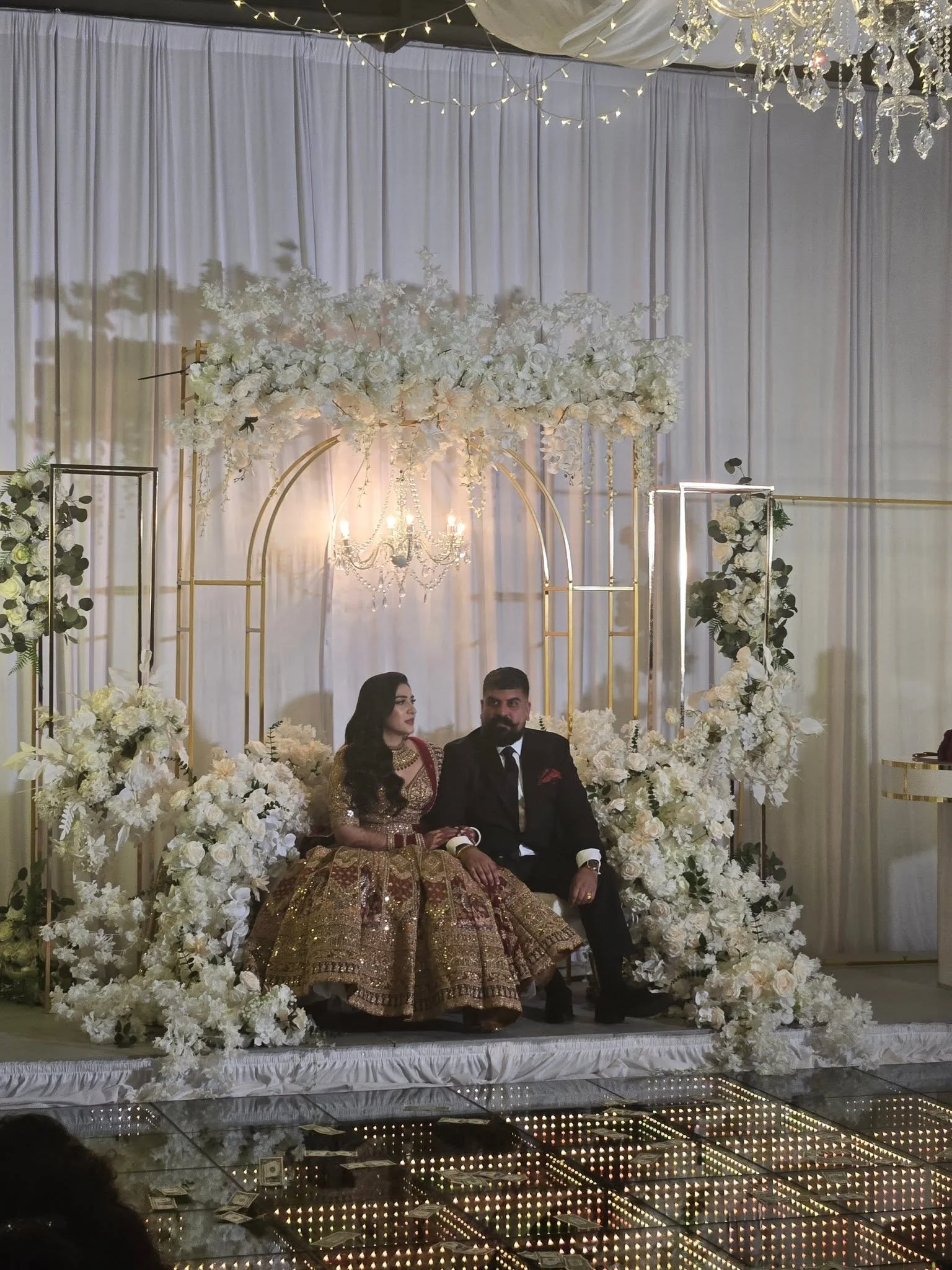 A couple sitting in the center of the event floor