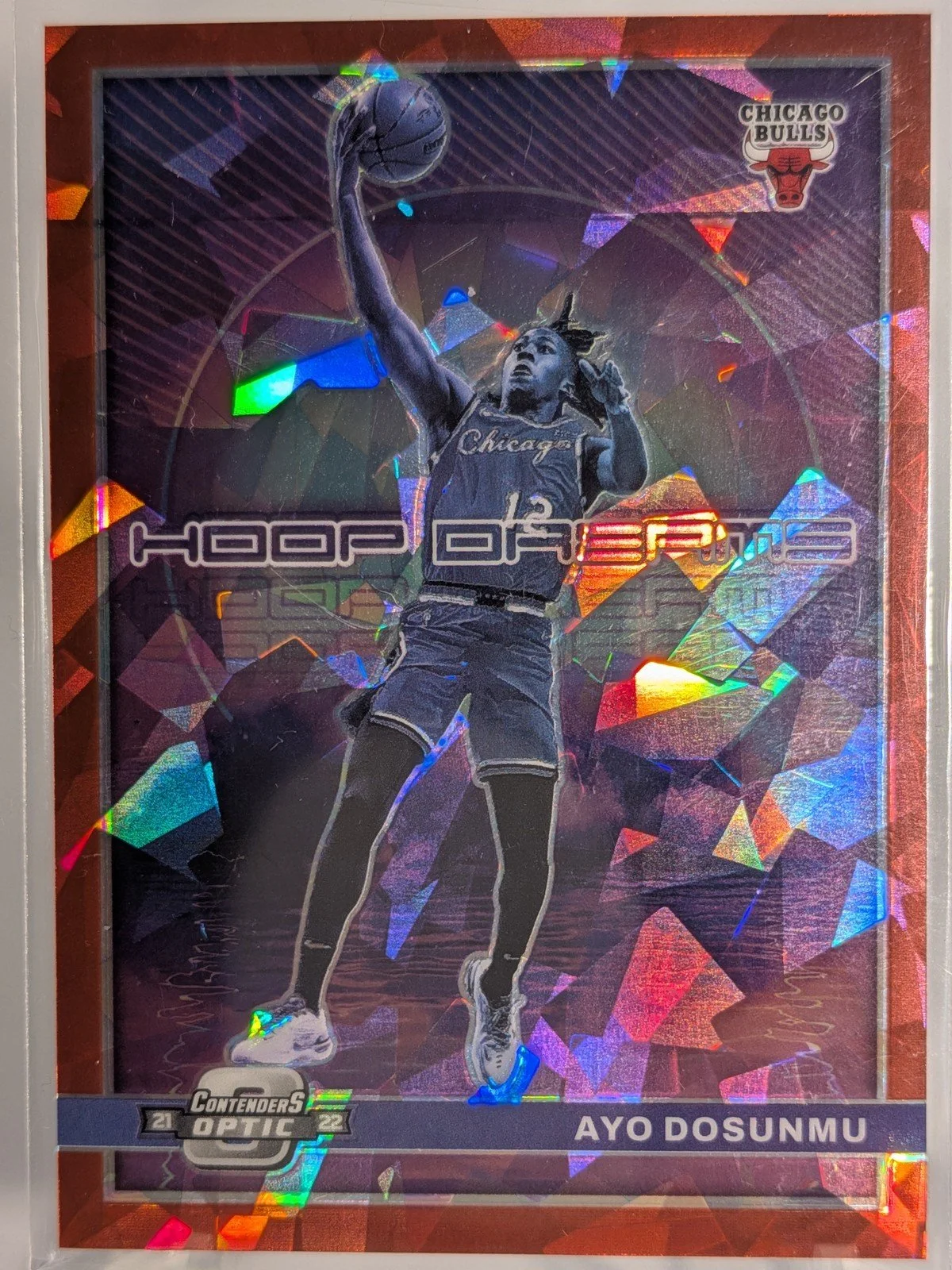 Front of 2021-22 Panini Contenders Optic #22 Ayo Dosunmu Hoop Dreams Red Cracked Ice
