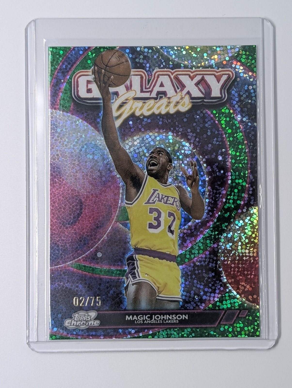 Front of 2025 Topps Cosmic Chrome GG-30 Magic Johnson /75 Galaxy Greats Green Space Dust
