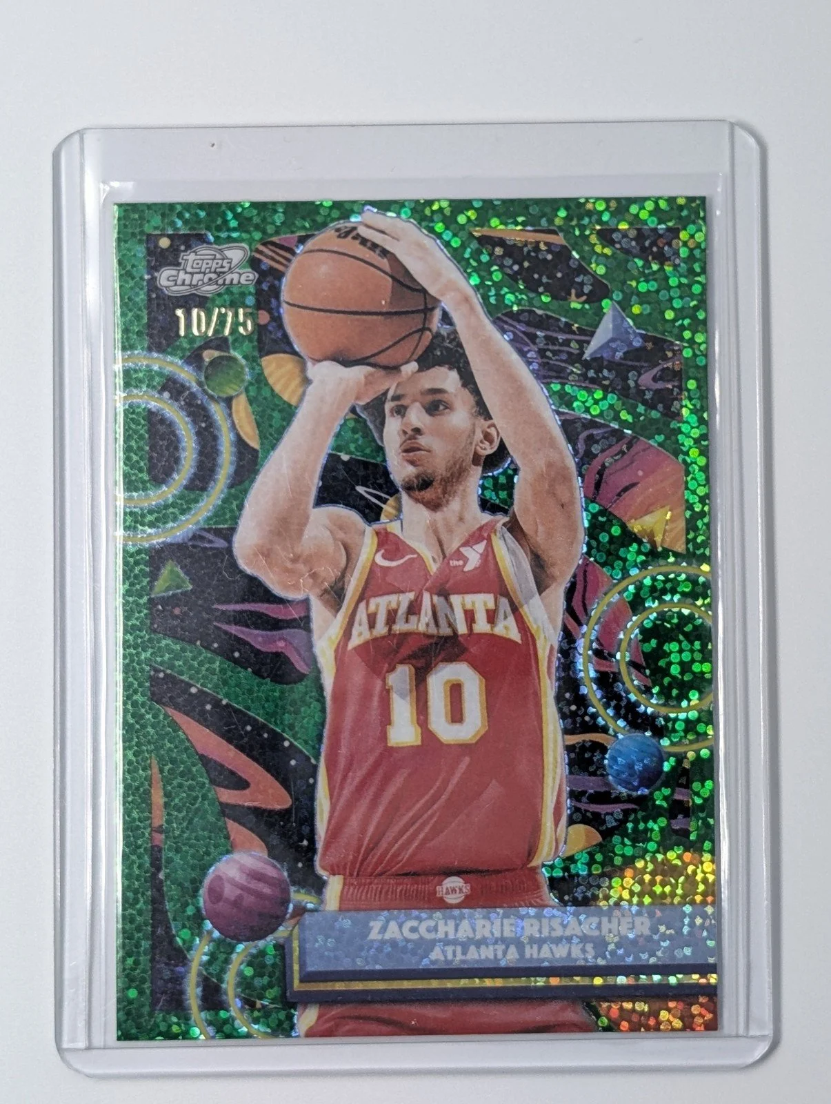 Front of 2025-26 Topps Chrome Cosmic #52 Zaccharie Risacher /75 Green Space Dust