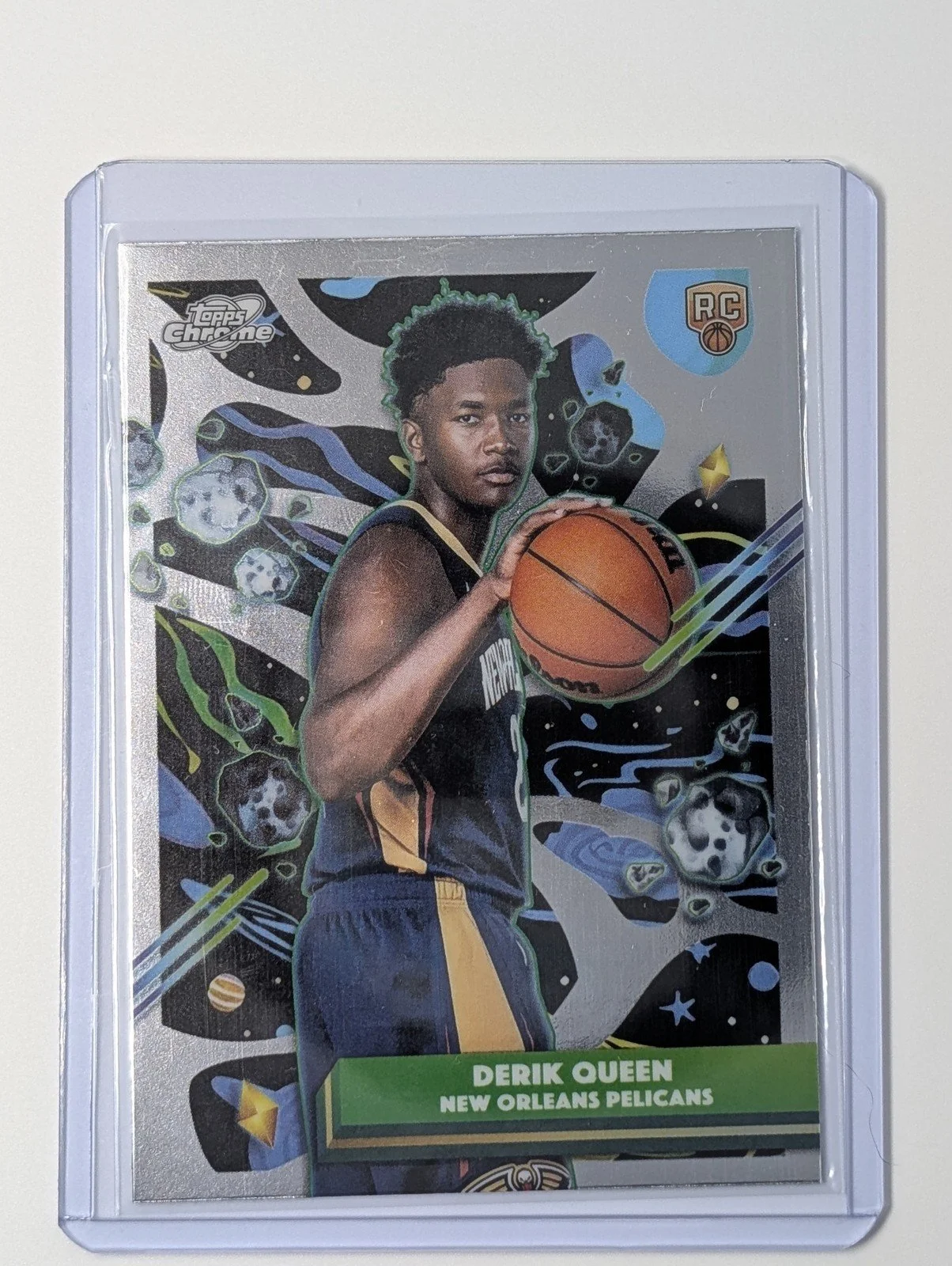 Front of 2025-26 Topps Chrome Cosmic #92 Derik Queen Rookie RC