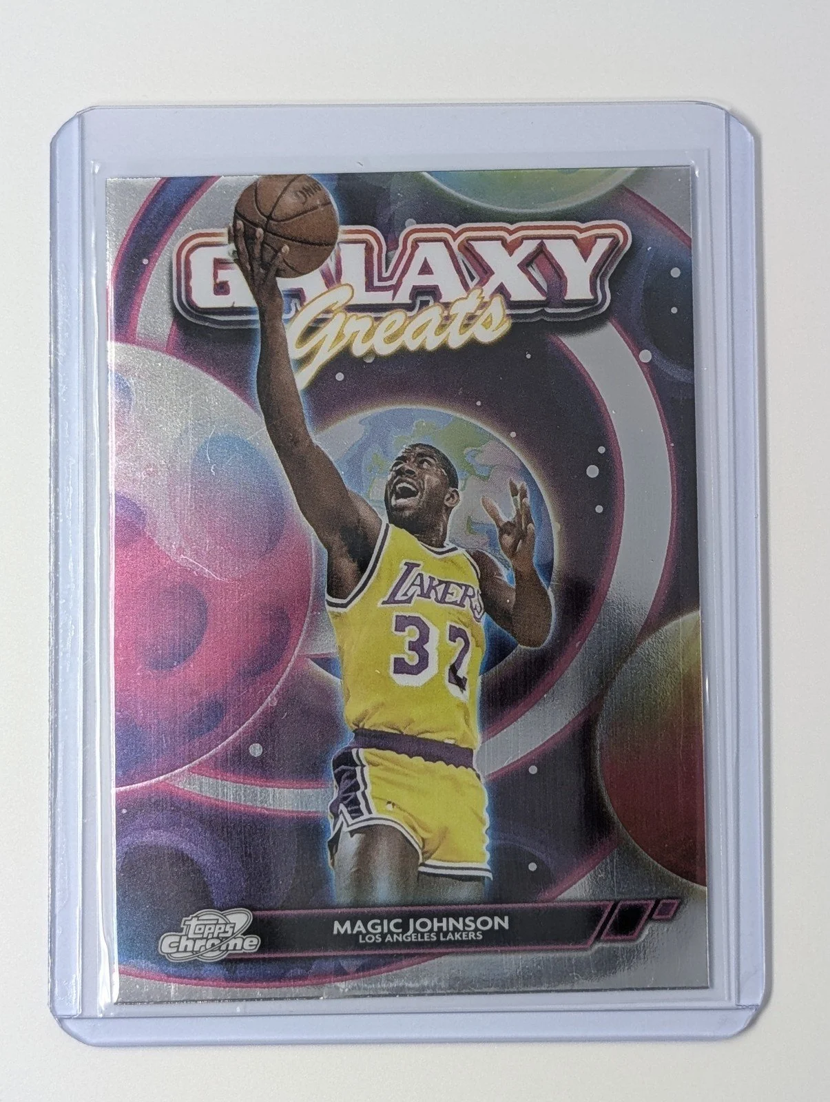 Front of 2025-26 Topps Cosmic Chrome #GG-30 Galaxy Great Magic Johnson
