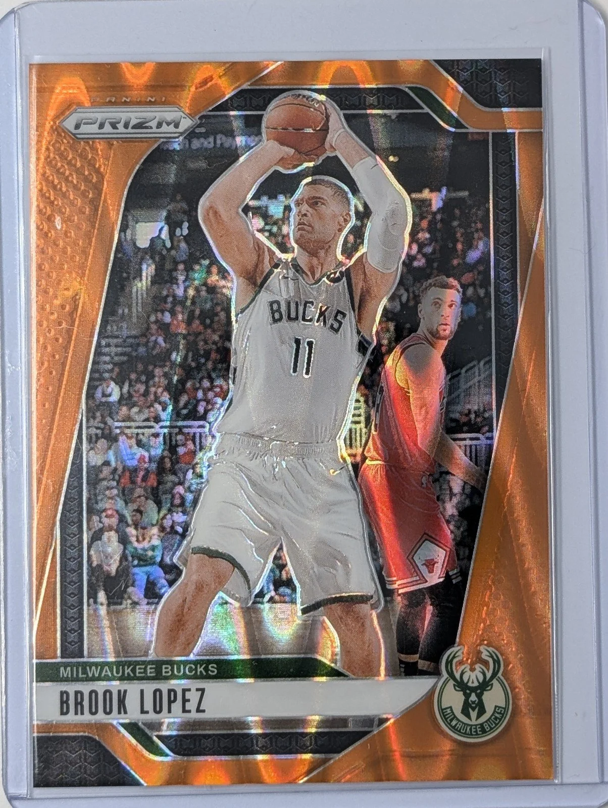 Front of 2024-25 Panini Prizm Brook Lopez #74 Orange Seismic Prizm 4/199