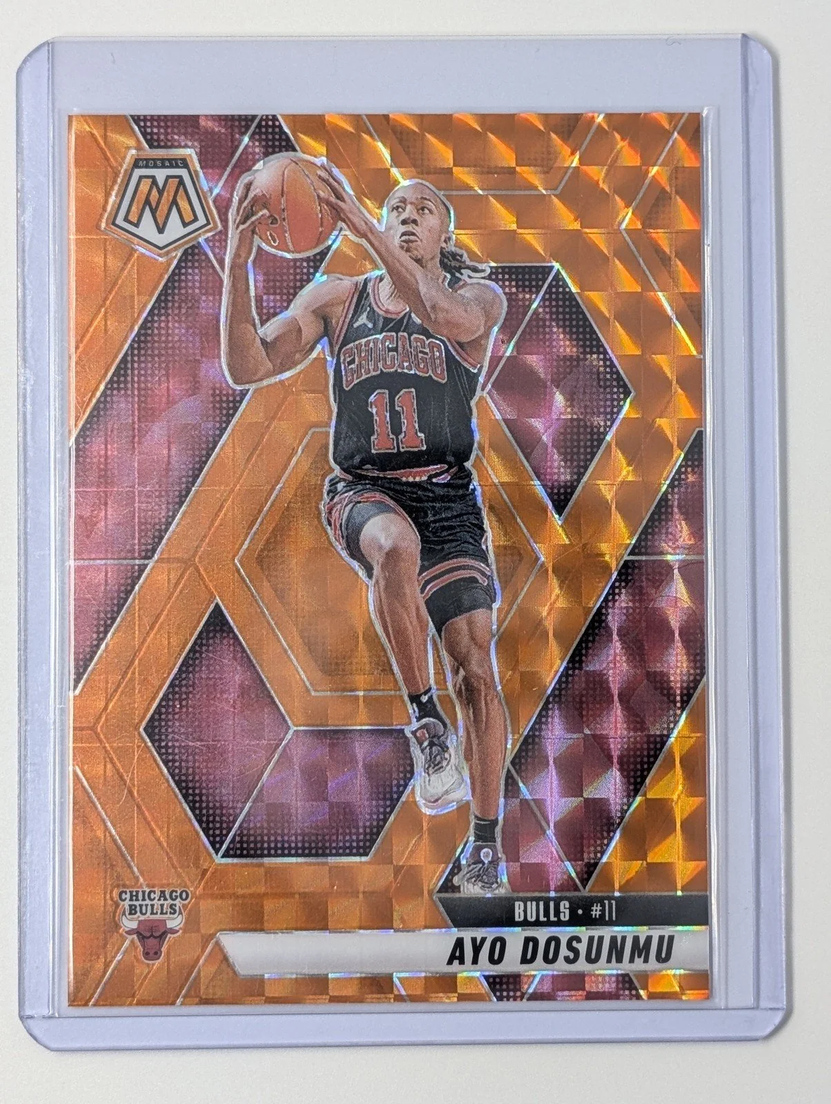 Front of 2024-25 Panini Mosaic #32 Ayo Dosunmu Orange Mosaic #/249