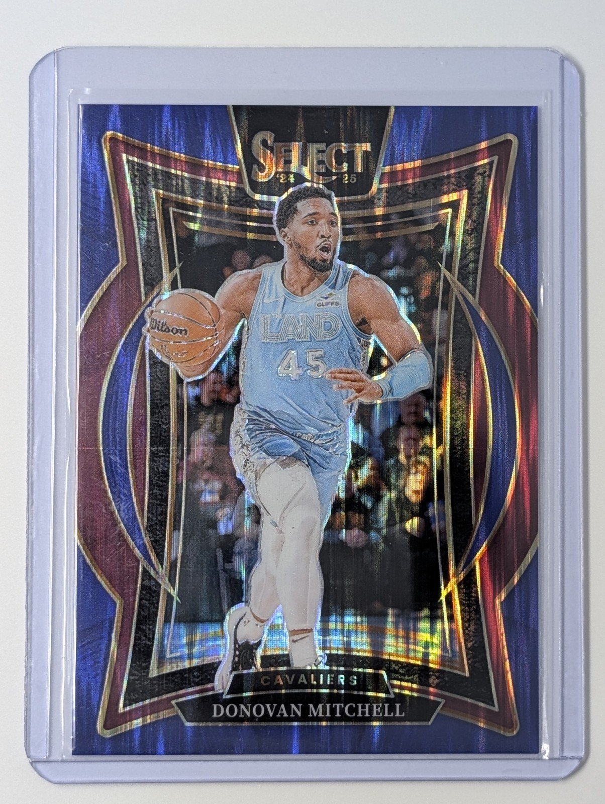 Front of 2024-25 Panini Select #21 Donovan Mitchell Blue Flash Prizm #/99