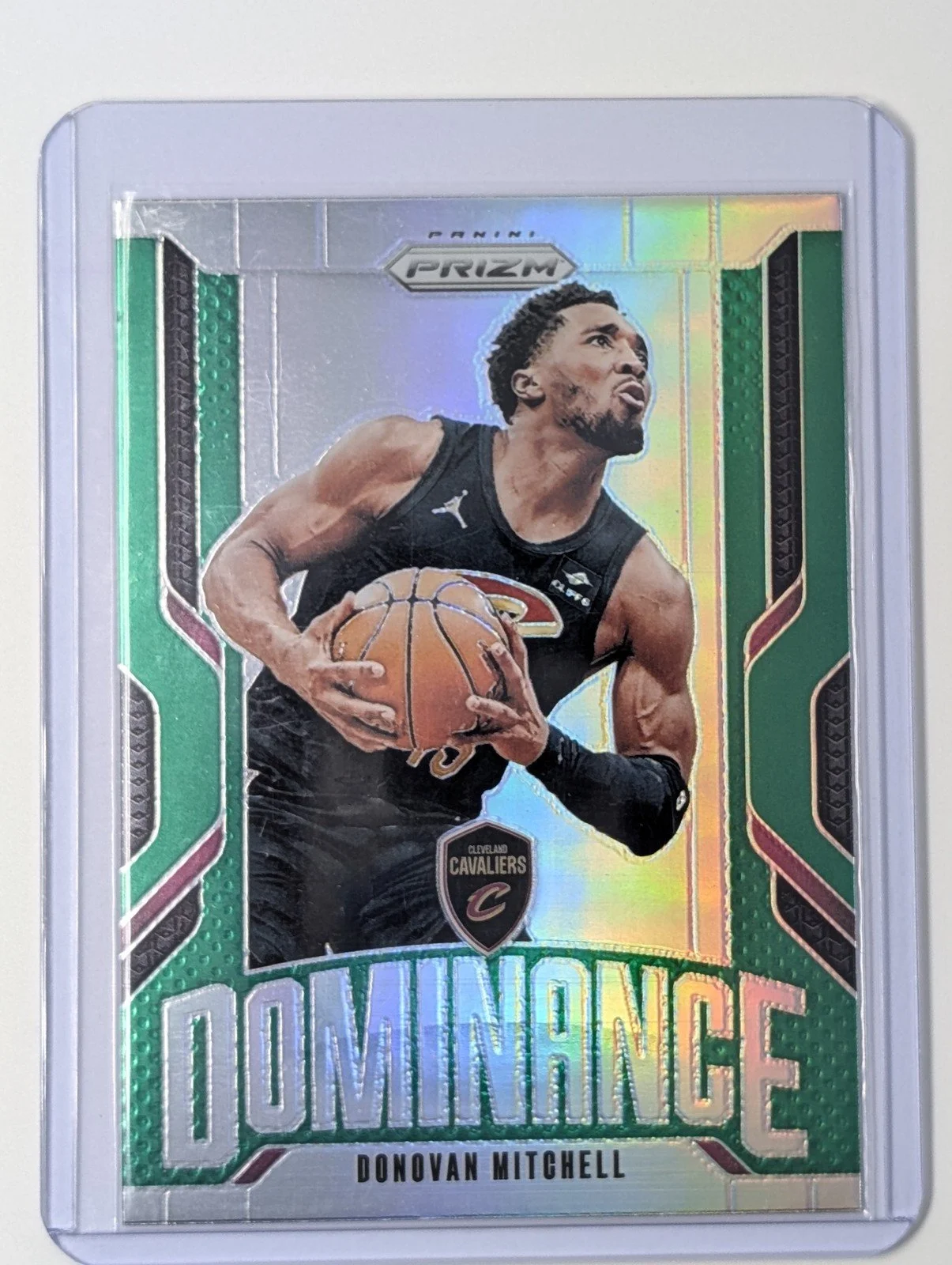 Front of 2024-25 Panini Prizm #23 Donovan Mitchell Dominance Prizms Green