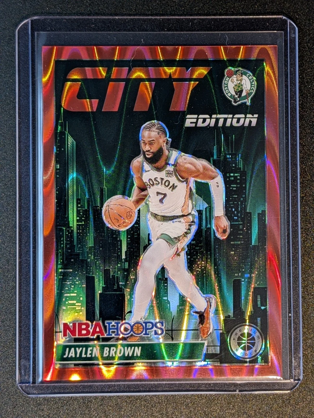 Front of 2023-24 Hoops Premium Stock #1 Jaylen Brown City Edition Red Seismic Prizm #/199