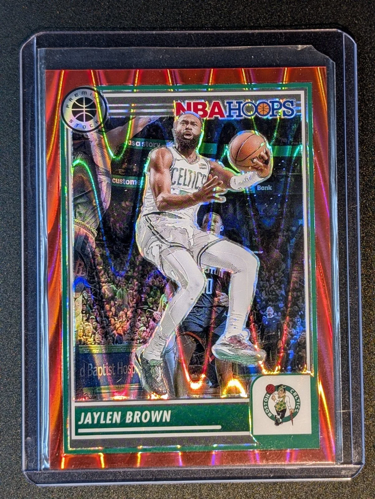 Front of 2023-24 Hoops Premium Stock #81 Jaylen Brown Red Seismic Prizm #/199