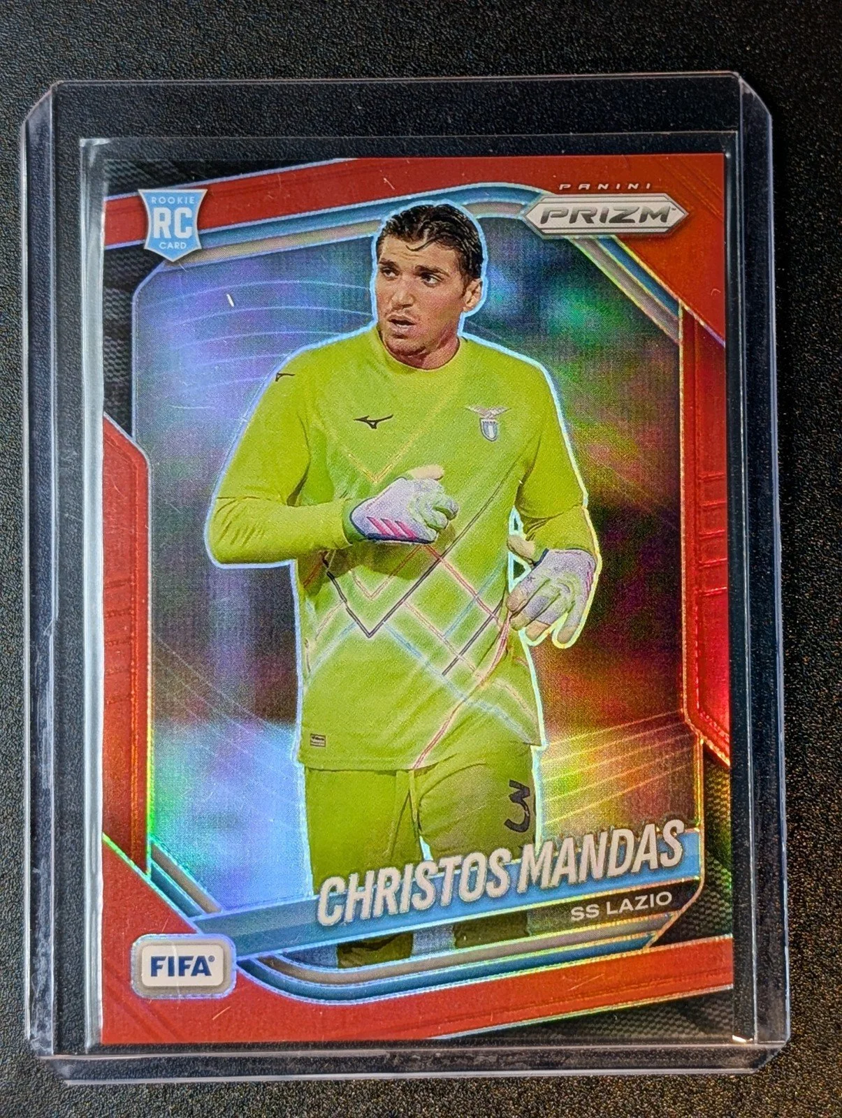 Front of 2025-26 Panini Prizm FIFA #127 Christos Mandas Red Prizms #/149
