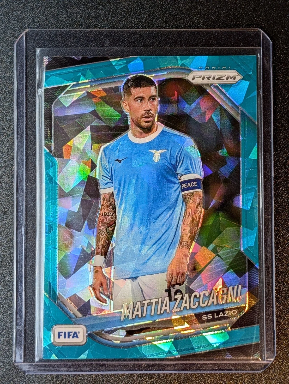 Front of 2025-26 Panini Prizm FIFA #120 Mattia Zaccagni Teal Ice Prizms #/99