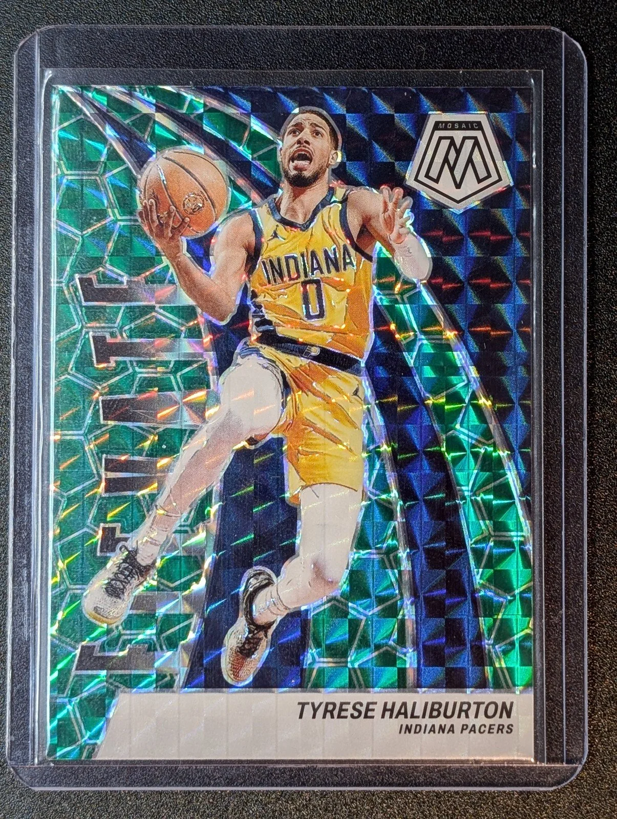 Front of 2023-24 Panini Mosaic #1 Tyrese Haliburton Elevate Mosaic Green