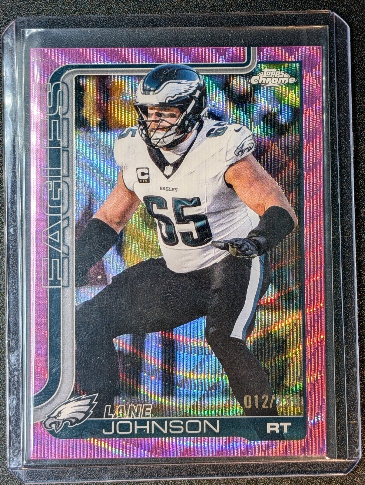 Front of 2025 Topps Chrome #246 Lane Johnson Pink Wave Refractor #/250
