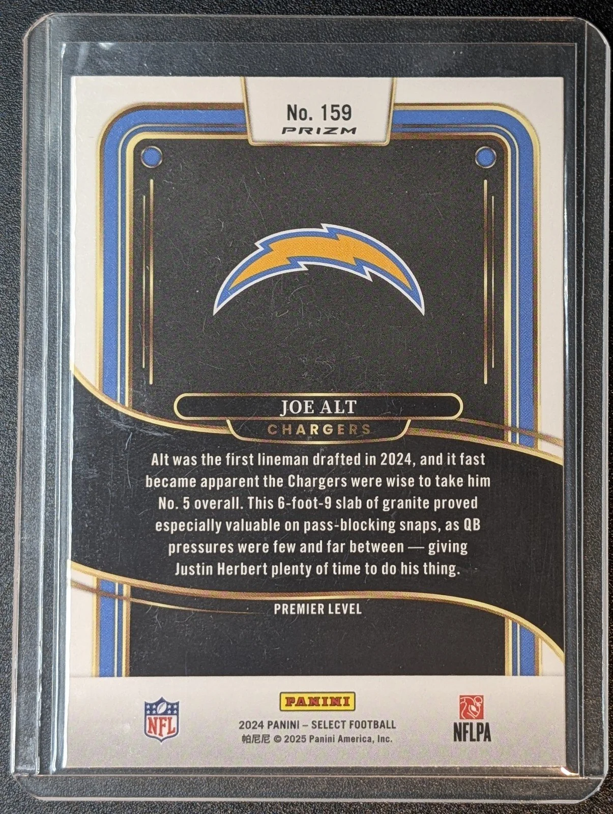 Back of 2024 Panini Select #159 Joe Alt Black & Red Prizm Shock RC