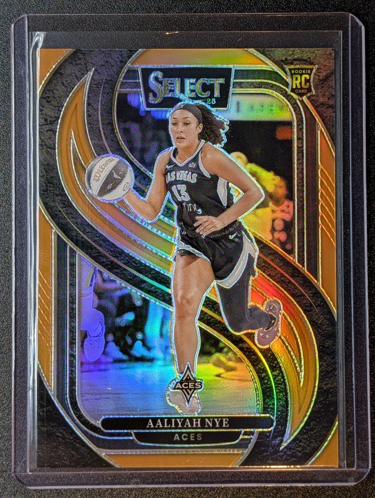 Front of 2025 Panini Select WNBA /125 Aaliyah Nye Orange Prizm #123 RC