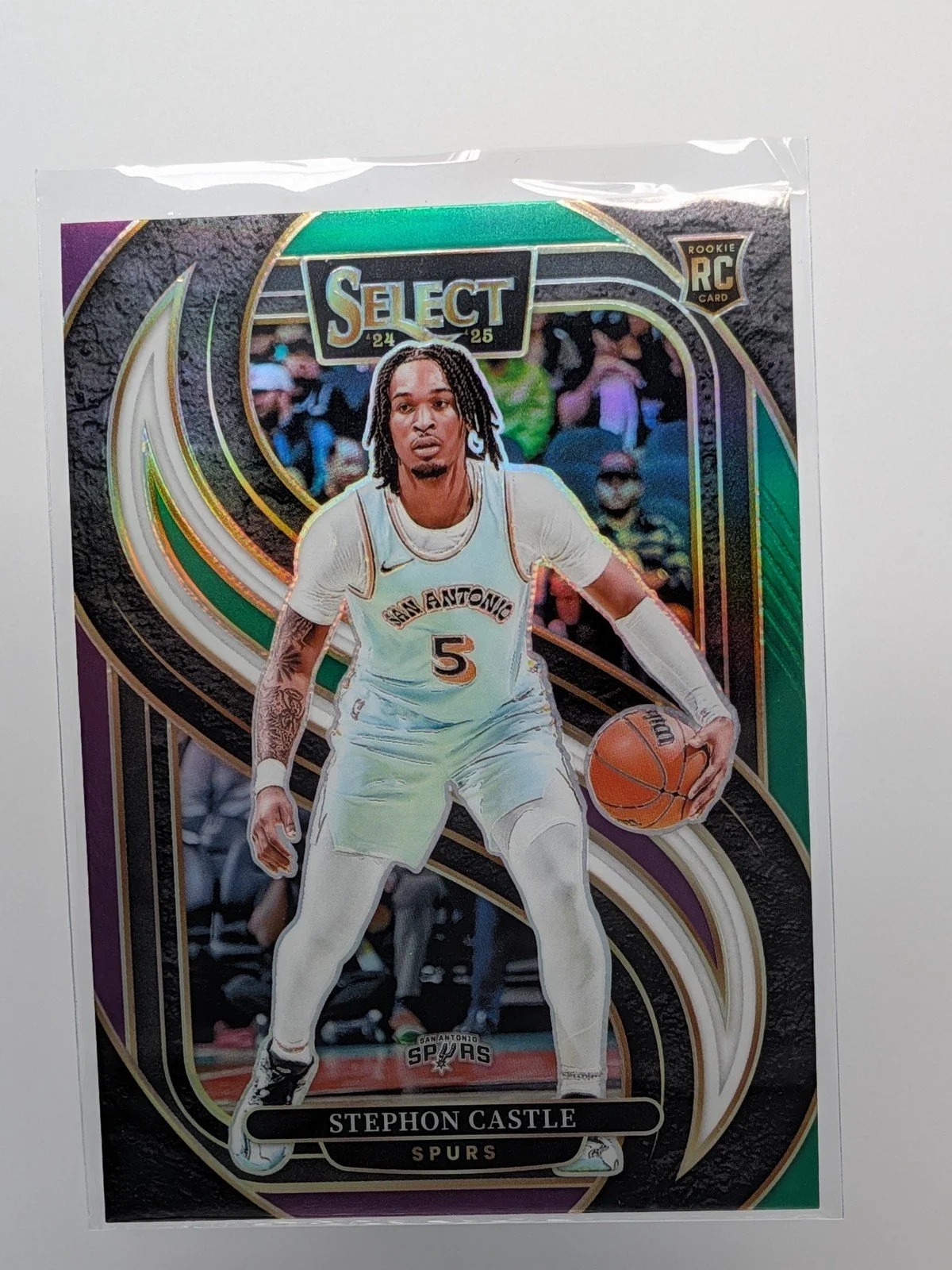 Front of 2024-25 Panini Select #175 Stephon Castle Green White Purple Tri-Color Prizm RC