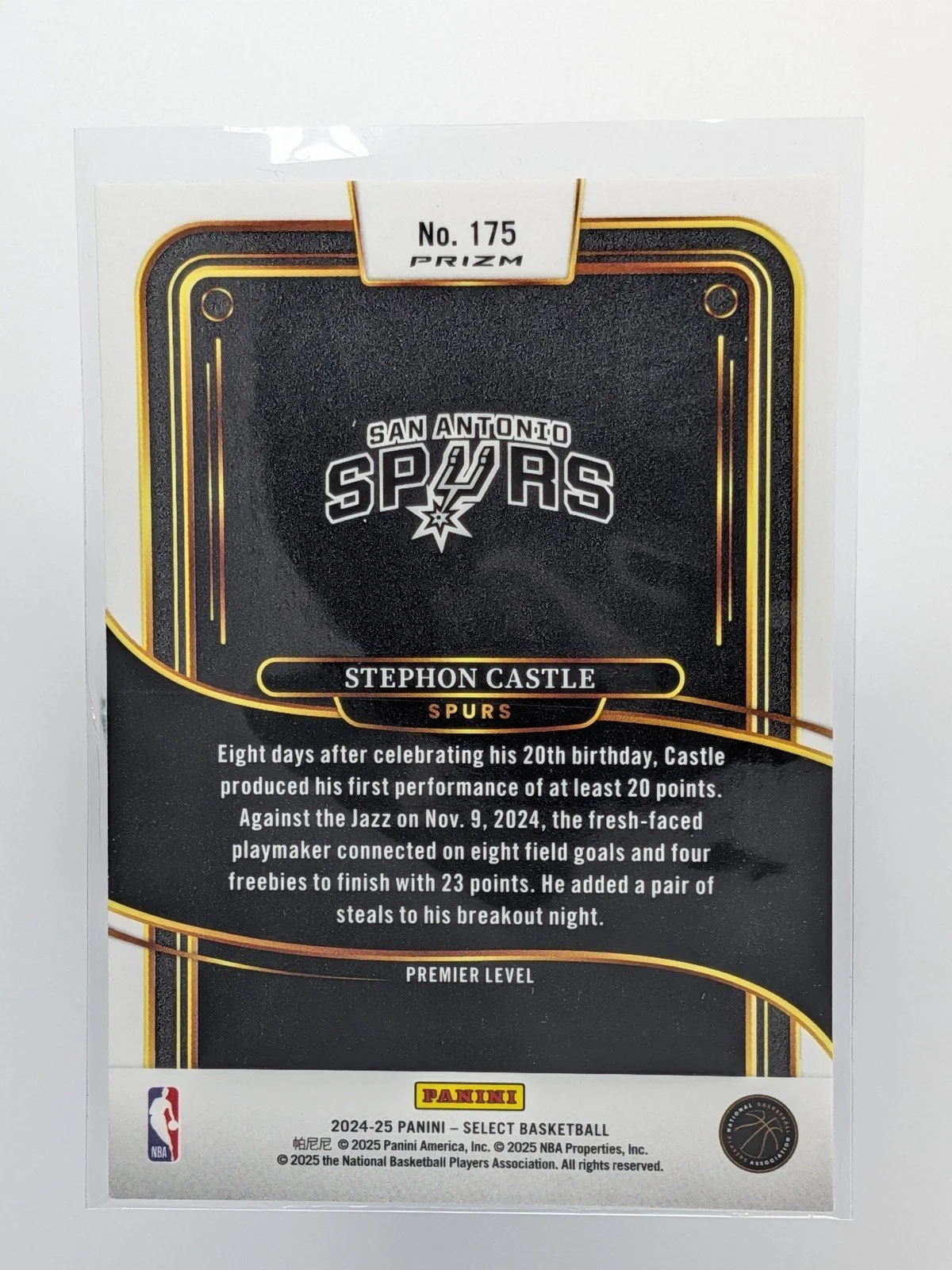 Back of 2024-25 Panini Select #175 Stephon Castle Green White Purple Tri-Color Prizm RC