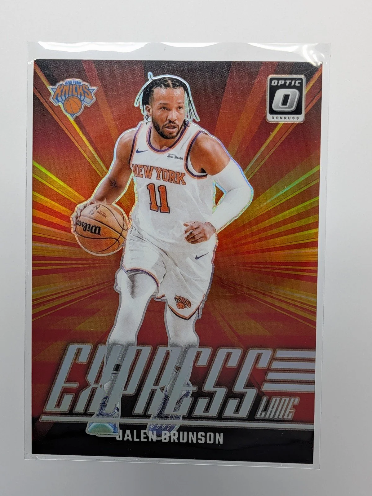 Front of 2024-25 Donruss Optic #21 Jalen Brunson Express Lane Holo Prizm