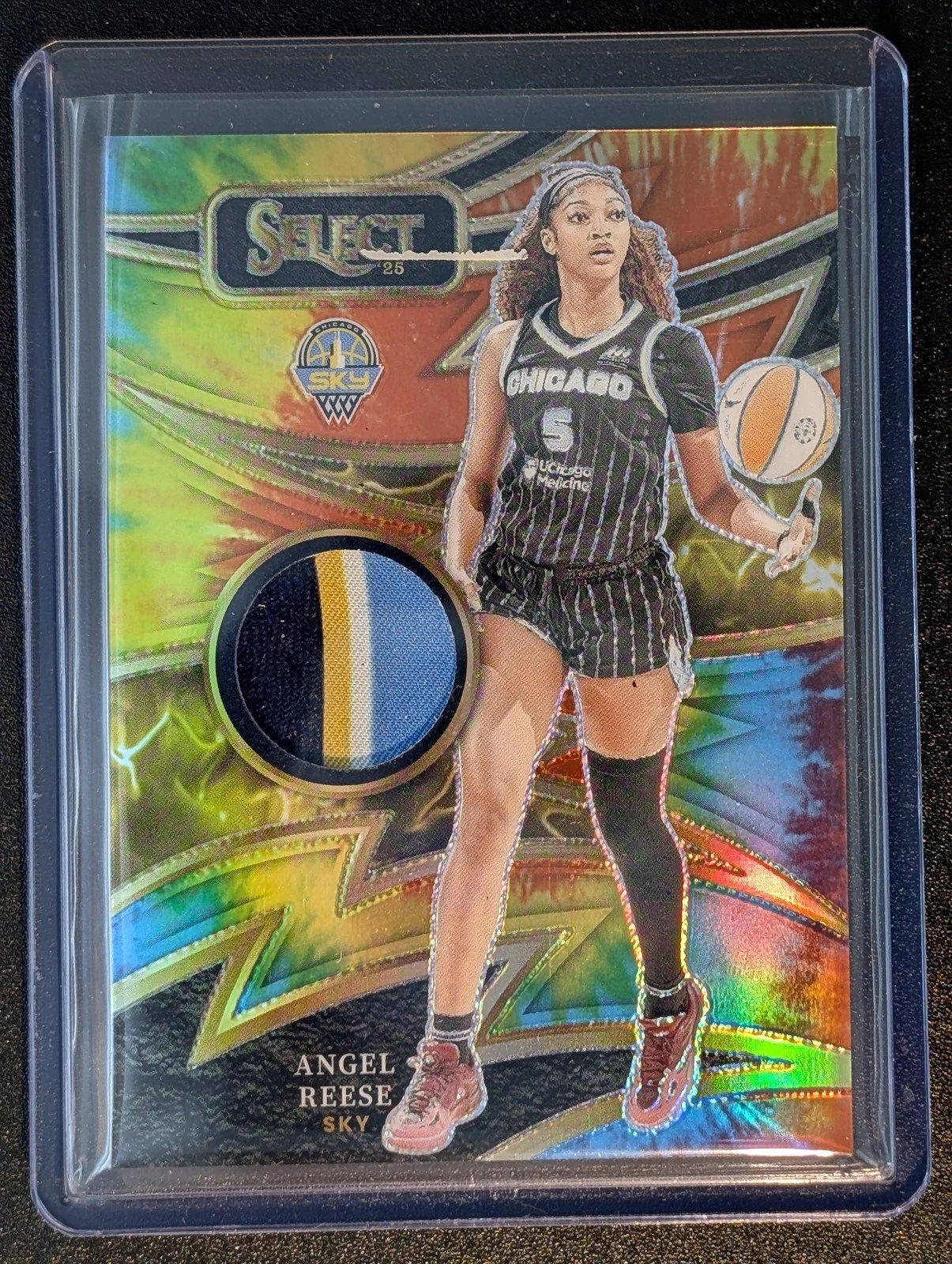 Front of 2025 Panini Select WNBA #SP-AR /25 Angel Reese Tie-Die patch 7/25
