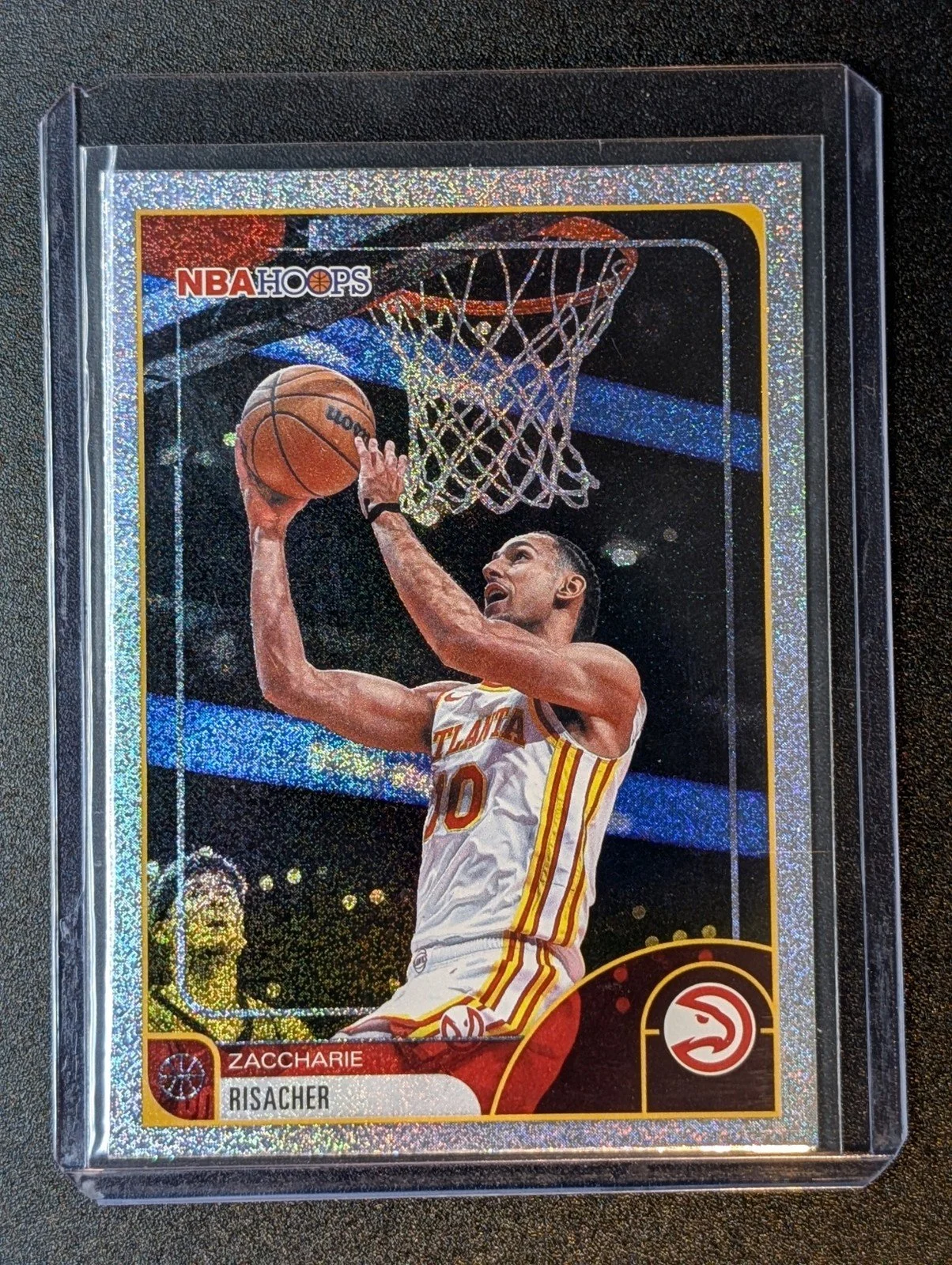 Front of 2025-26 Hoops #105 Zaccharie Risacher Pixel Burst