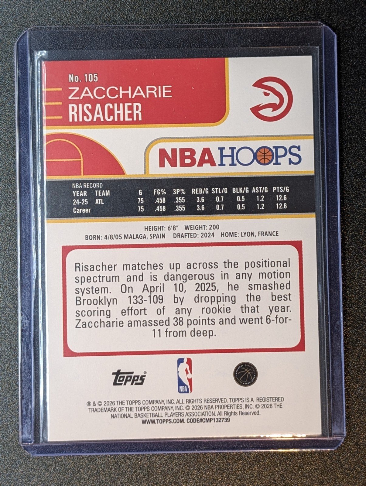 Back of 2025-26 Hoops #105 Zaccharie Risacher Light Burst Green /75