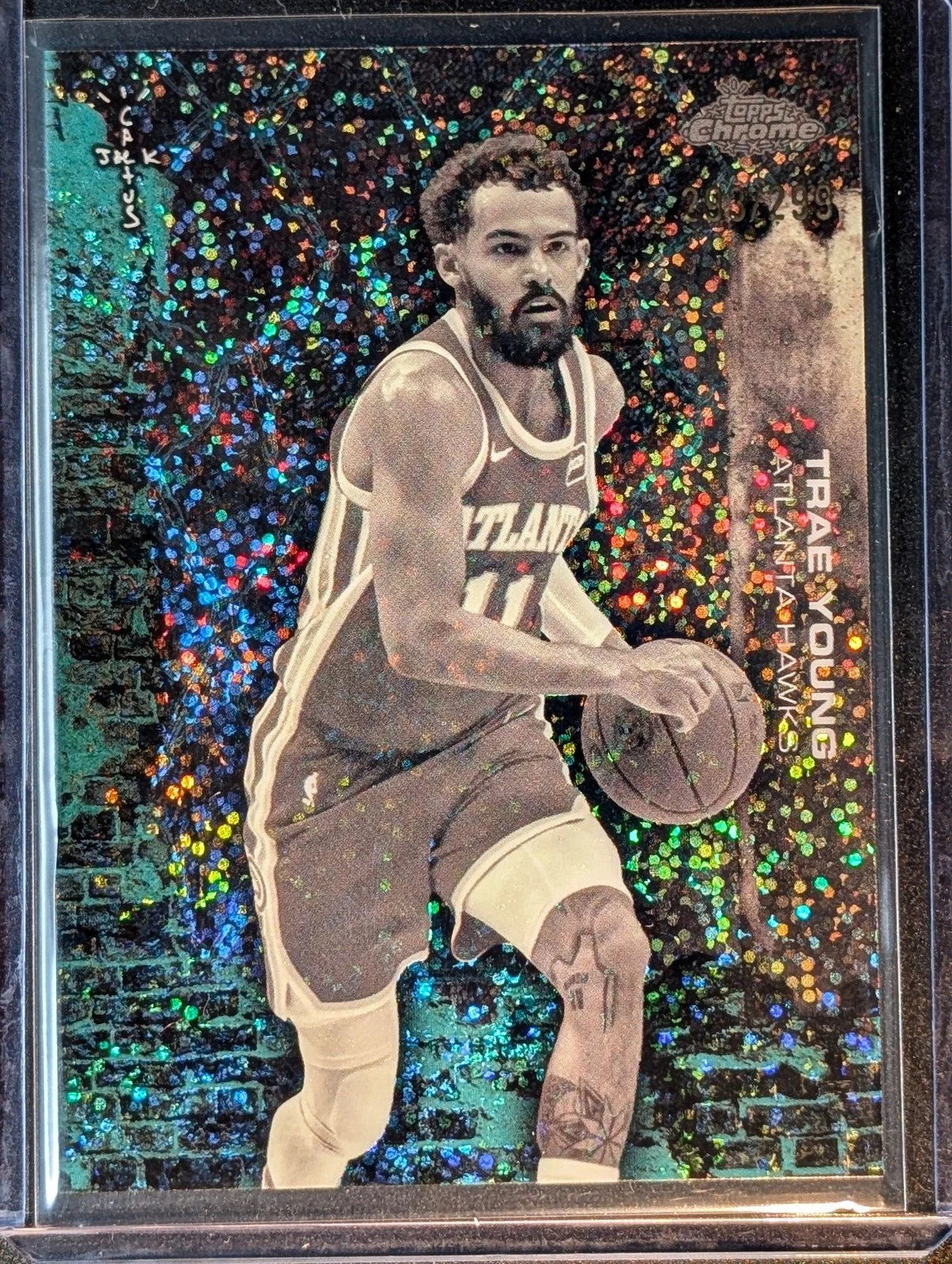 Front of 2025-26 Topps Chrome Cactus Jack #19 Trae Young Teal Speckle Refractor /299