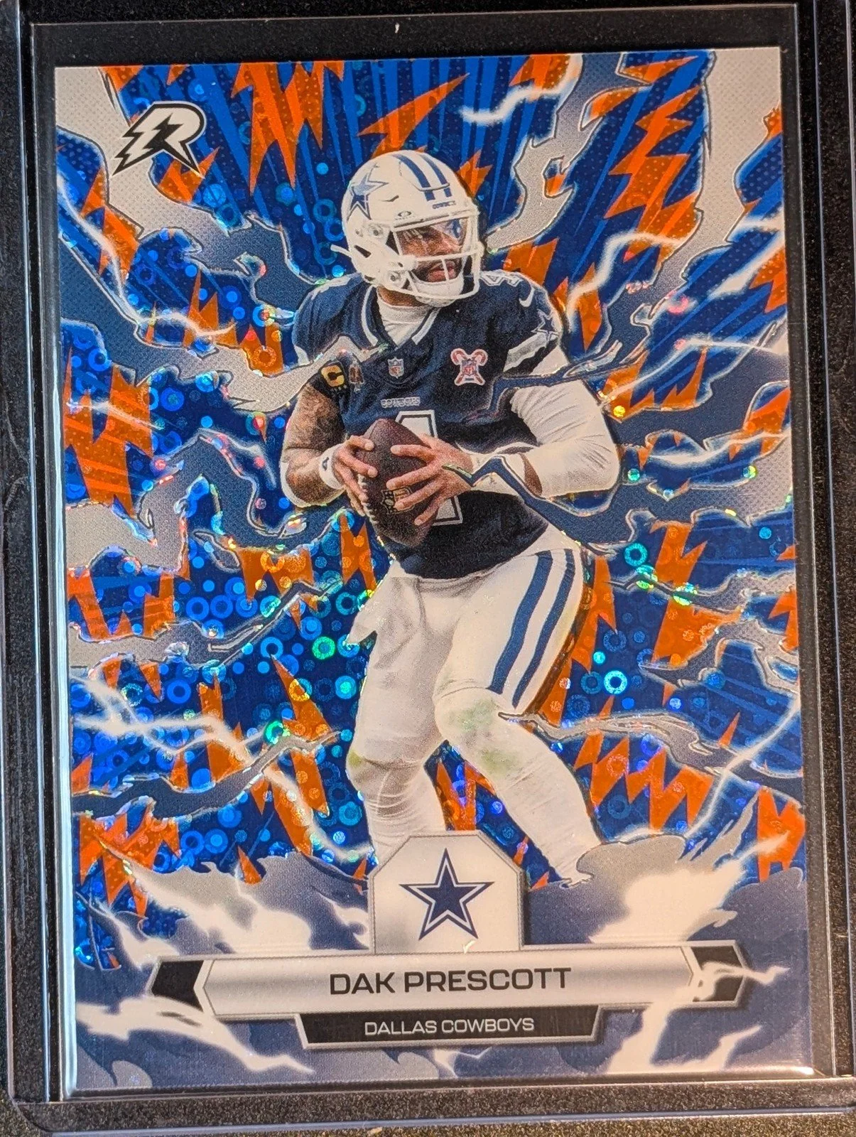 Front of 2025 Topps Resurgence #24 Dak Prescott Blue & Orange Spark Refractor