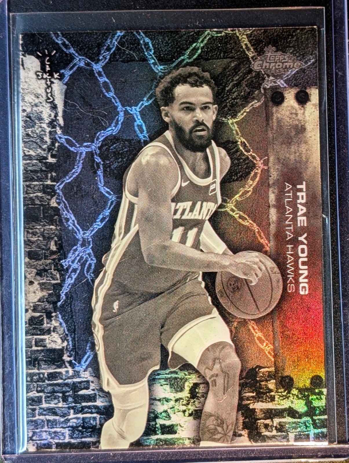 Front of 2025-26 Topps Chrome Cactus Jack #19 Trae Young Refractor