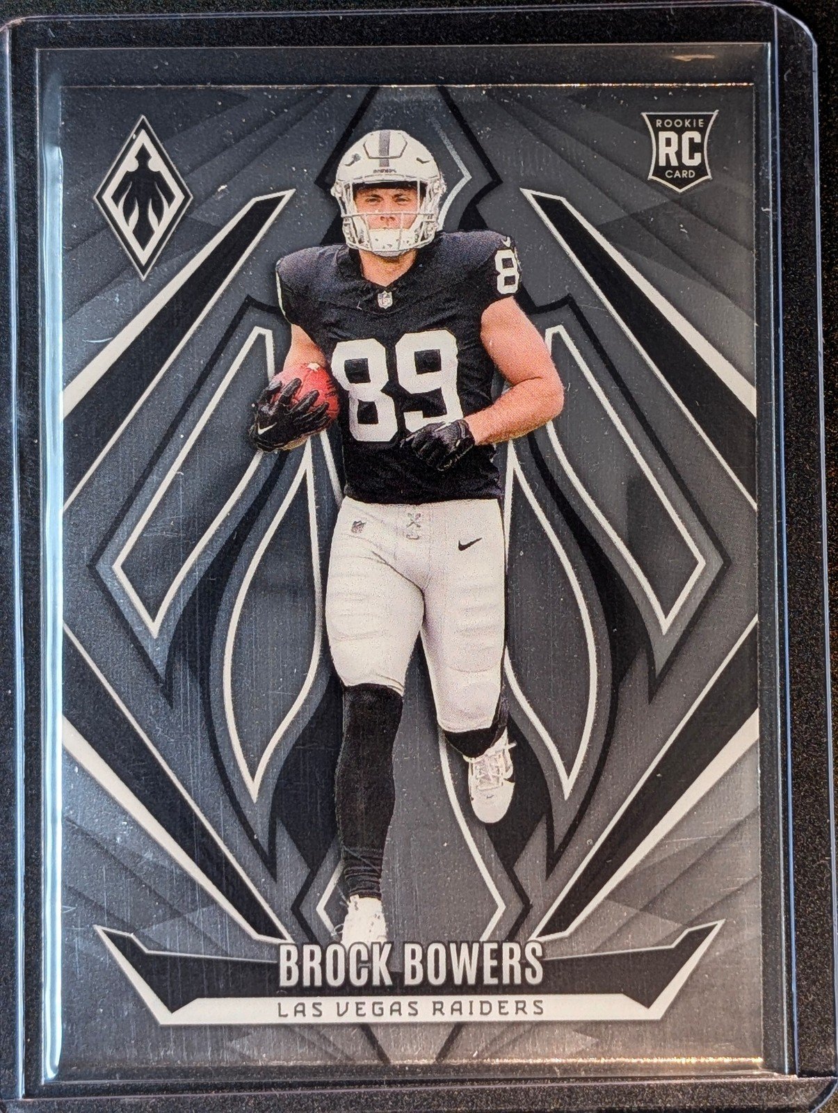 Front of 2024 Panini Phoenix #165 Brock Bowers Rookie