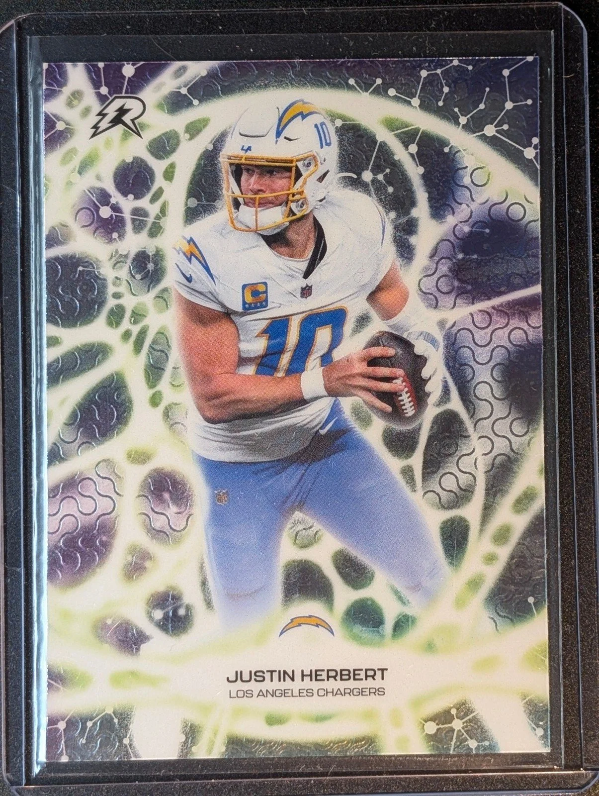 Front of 2025 Topps Resurgence #PT-7 Justin Herbert Protonyx