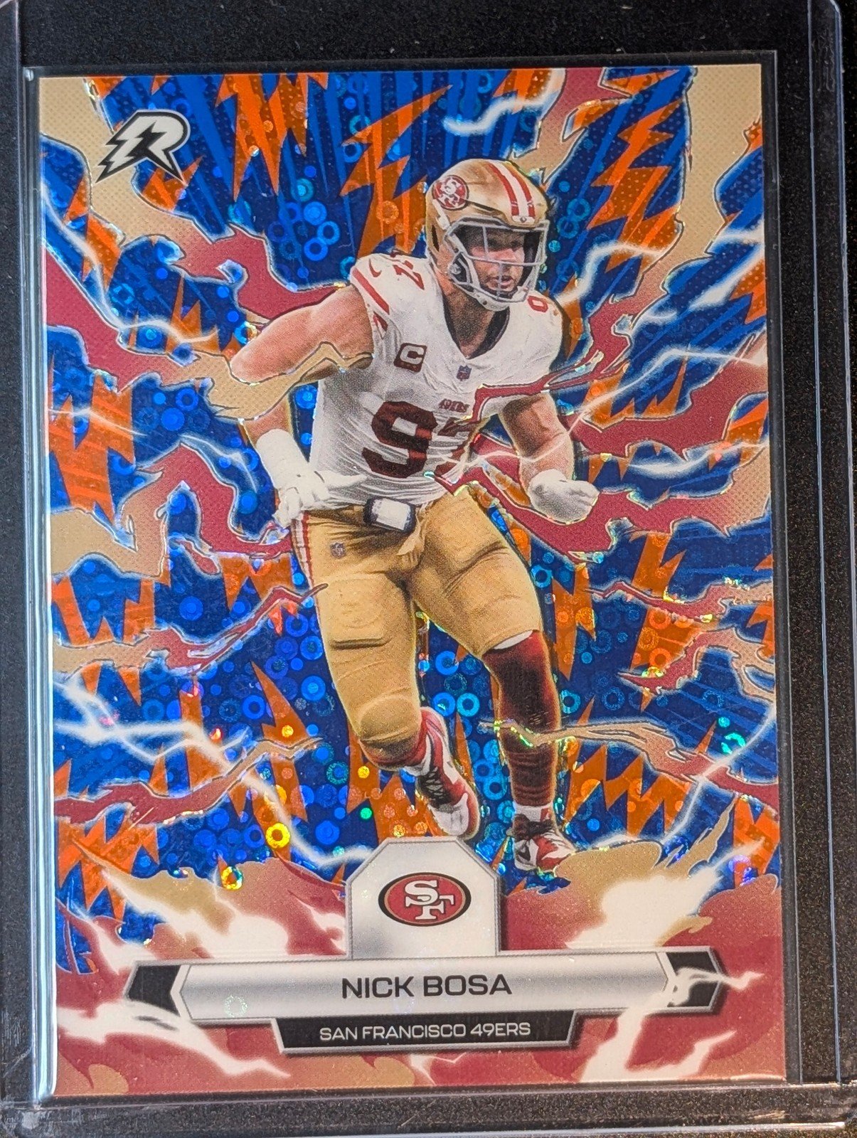 Front of 2025 Topps Resurgence #89 Nick Bosa Blue & Orange Spark Refractor