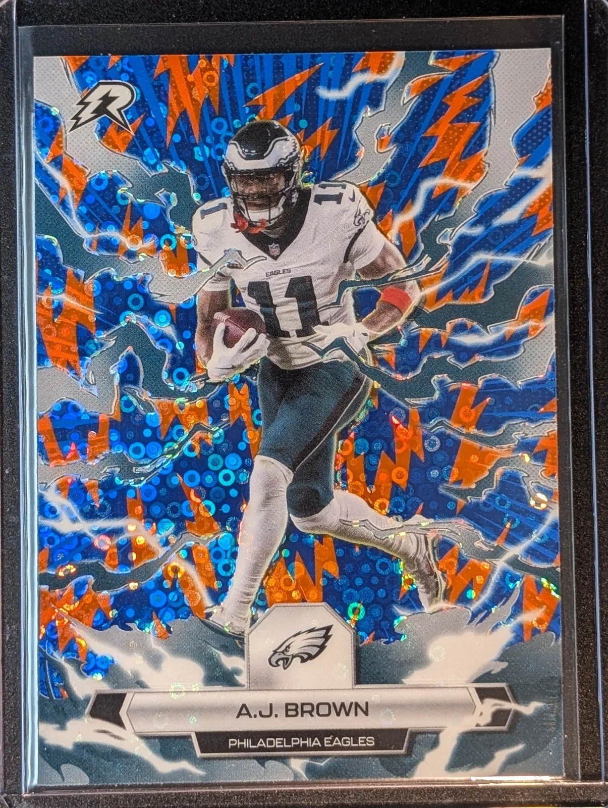 Front of 2025 Topps Resurgence #78 A.J. Brown Blue & Orange Spark Refractor