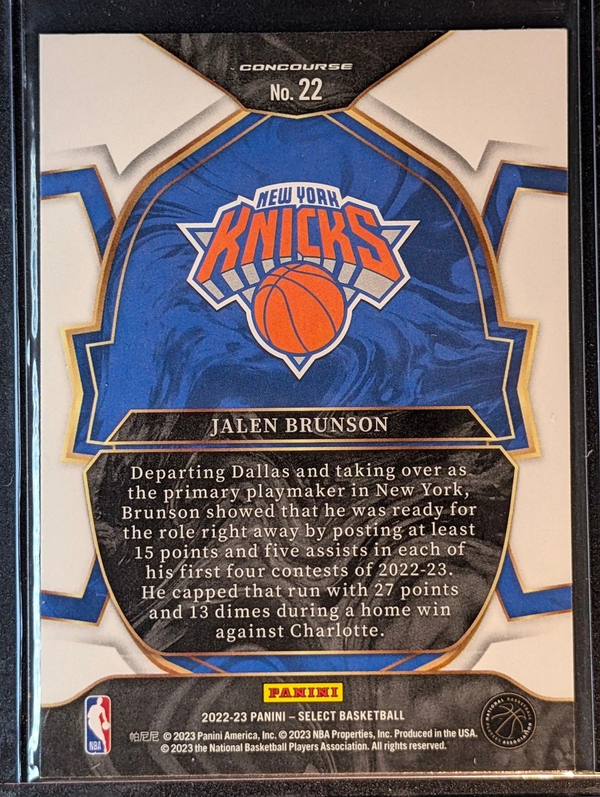 Back of 2021-22 Panini Select #224 Jalen Brunson Blue