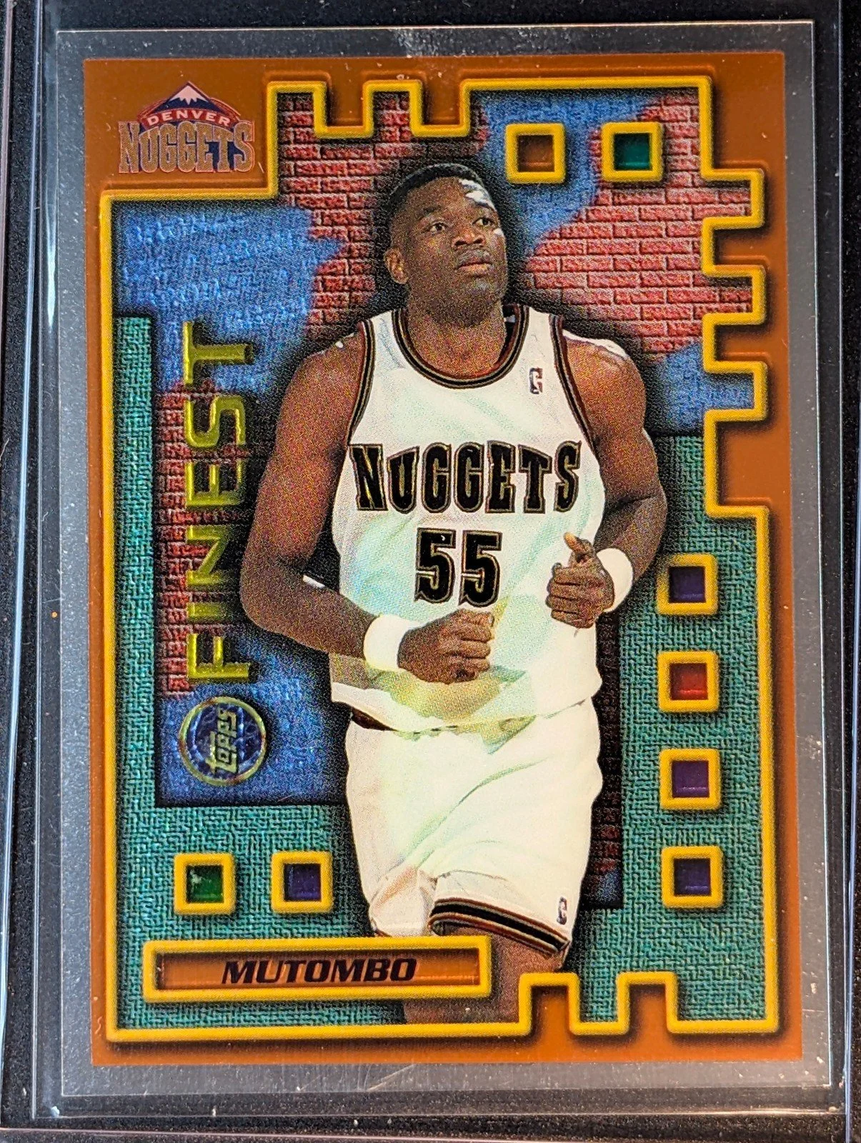 Front of 1995-96 Finest #M42 Dikembe Mutombo Mystery Borderless Silver